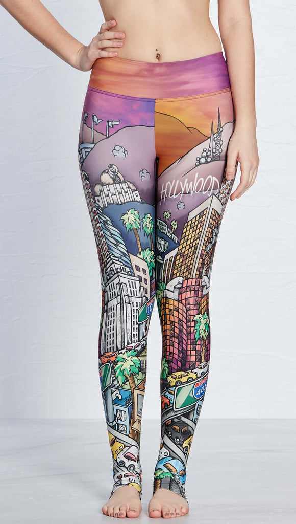 Model wearing WERKSHOP Los Angeles Athleisure Leggings ~ featuring original artwork showcasing iconic LA Landmarks including the Hollywood sign, the observatory, DTLA and the 405 Freeway.