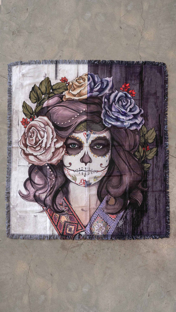 Decorative Chenille Tapestry printed with limited edition artwork by our Female Founder, Chriztina Marie. The artwork celebrates Dia De Los Muertos with a drawing of a girl wearing sugarskull makeup surrounded by a wreath of roses.