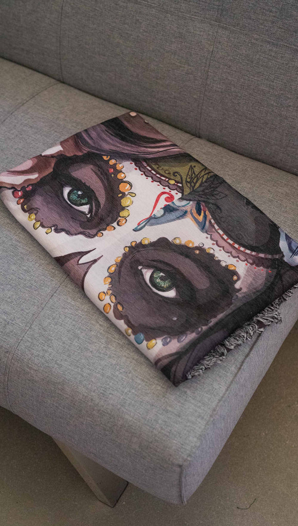 Decorative Chenille Tapestry printed with limited edition artwork by our Female Founder, Chriztina Marie. The artwork celebrates Dia De Los Muertos with a drawing of a girl wearing sugarskull makeup surrounded by a wreath of roses.