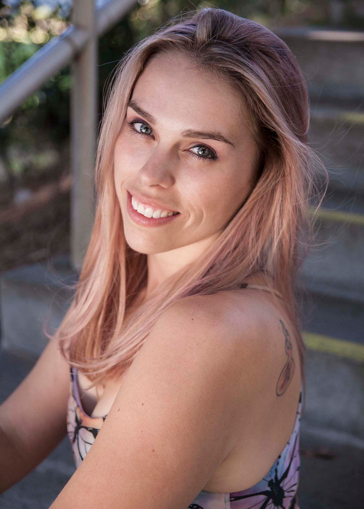 Headshot of founder, Chriztina Marie, wearing a WERKSHOP Butterflies Sports Bra