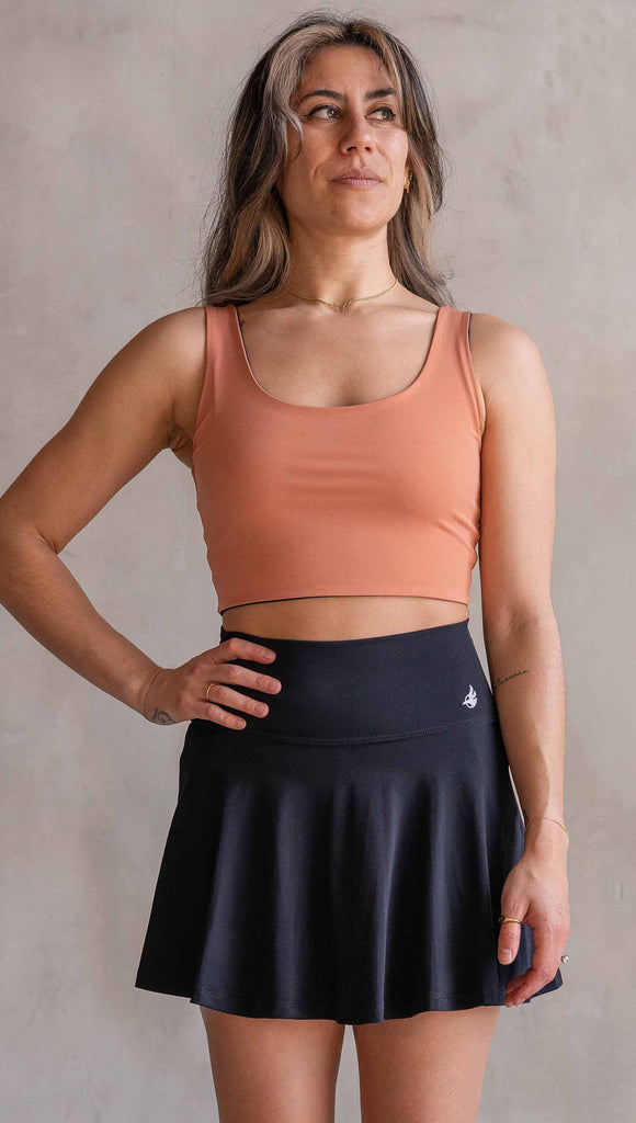 Model wearing WERKSHOP Four Way Reversible Top in EnviSoft Fabric. She is wearing the Toasted Nut side out in this photo with the “X” detail in the back.