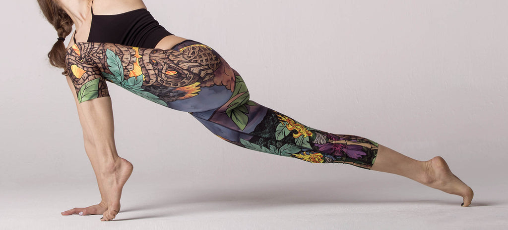 Yogi doing an advanced lizard pose while wearing WERKSHOP Tiki Tiki Time Capri Length Leggings