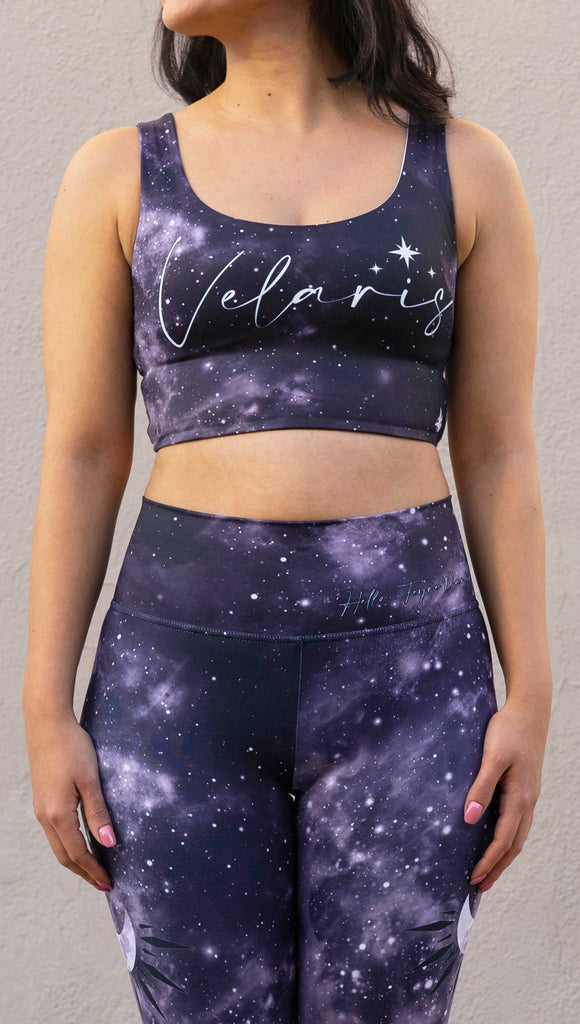 Model wearing Officially Licensed ACOTAR Top with "Velaris" written across the chest over a dark purplish-blue celestial sky.