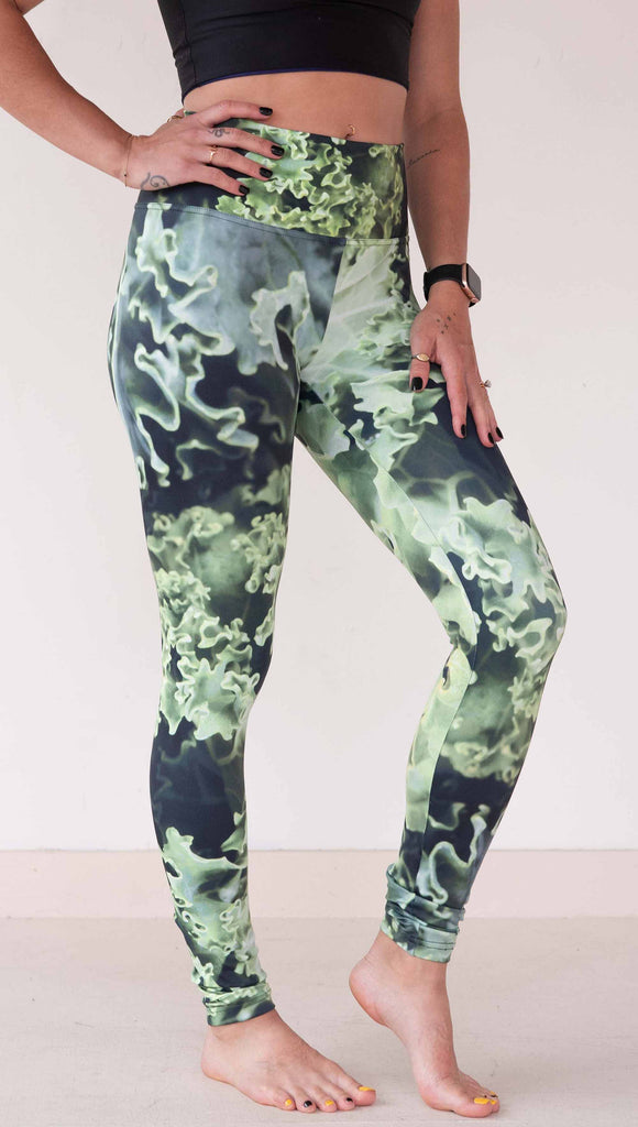 Model wearing WERKSHOP Leggings printed with a macro image of green kale.