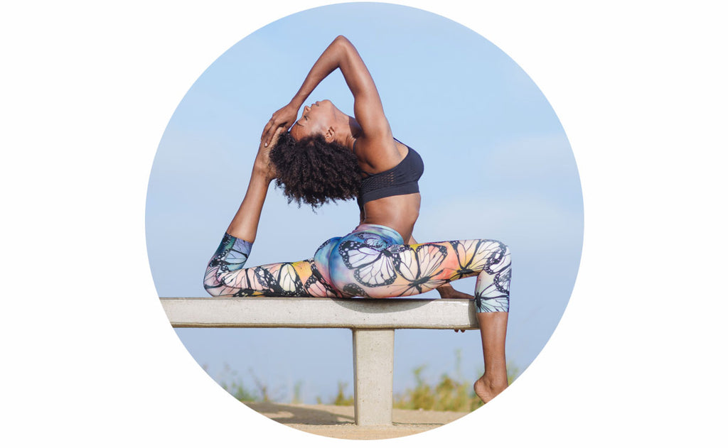 Girl doing an advanced pigeon variation while wearing WERKSHOP Butterflies Capri Leggings