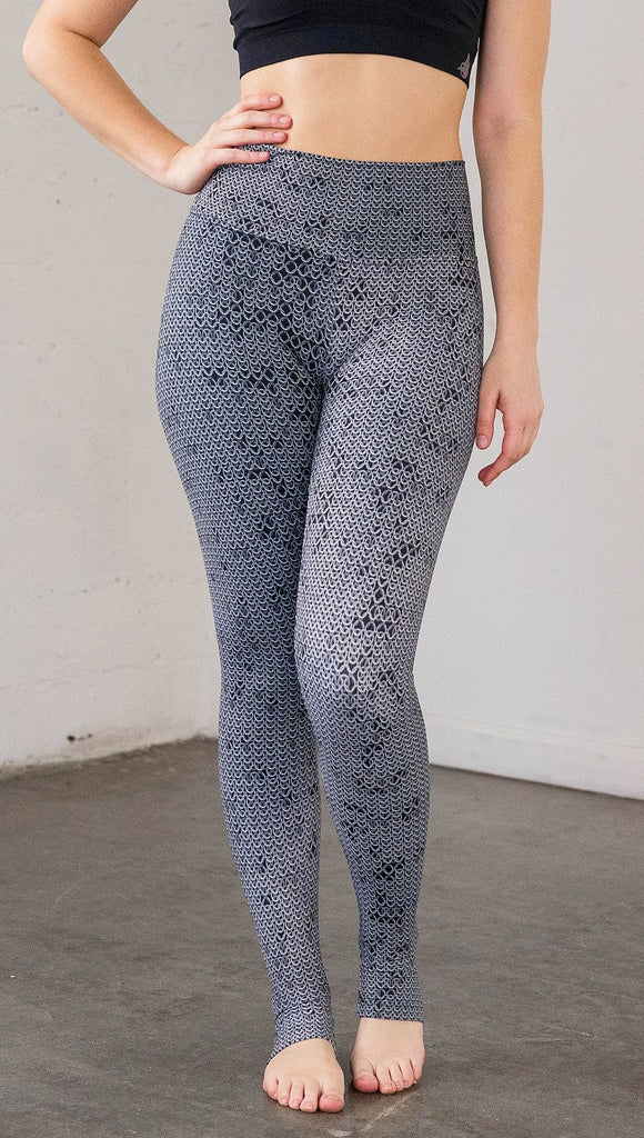 Front view of model wearing chainmaille inspired full length leggings