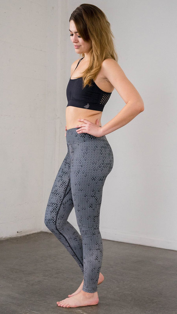 Left side view of model wearing chainmaille inspired full length leggings