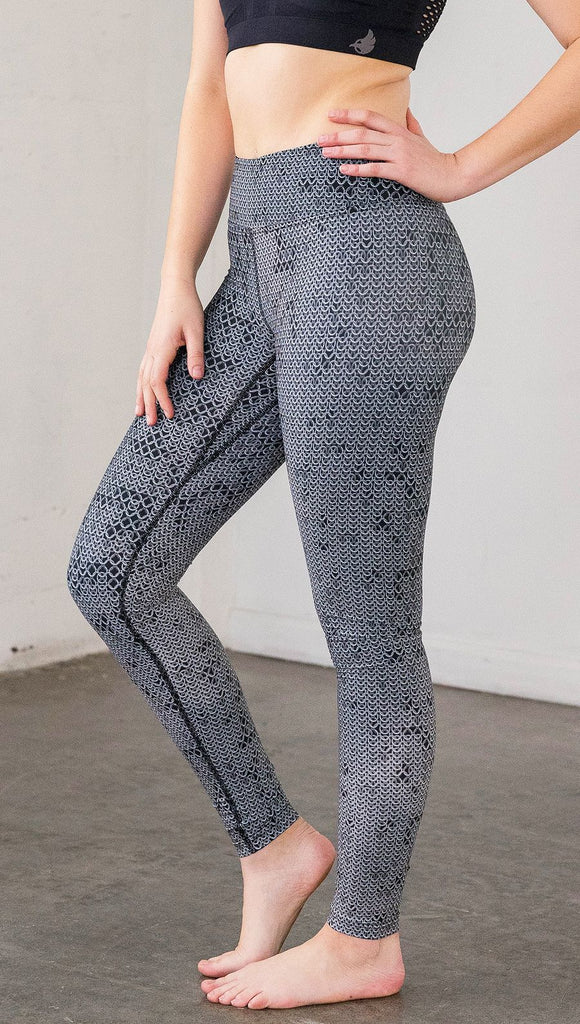 Left side view of model wearing chainmaille inspired full length leggings