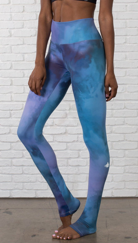 Close up front view of model wearing full length leggings with tanzanite watercolor printed design