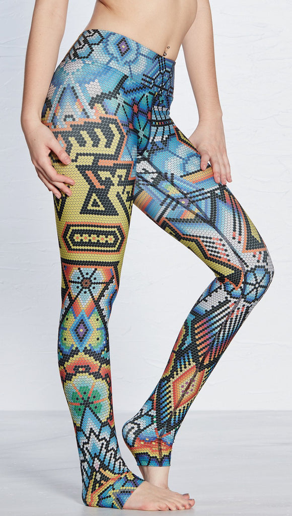 closeup side view of model wearing beaded deer themed printed full length leggings