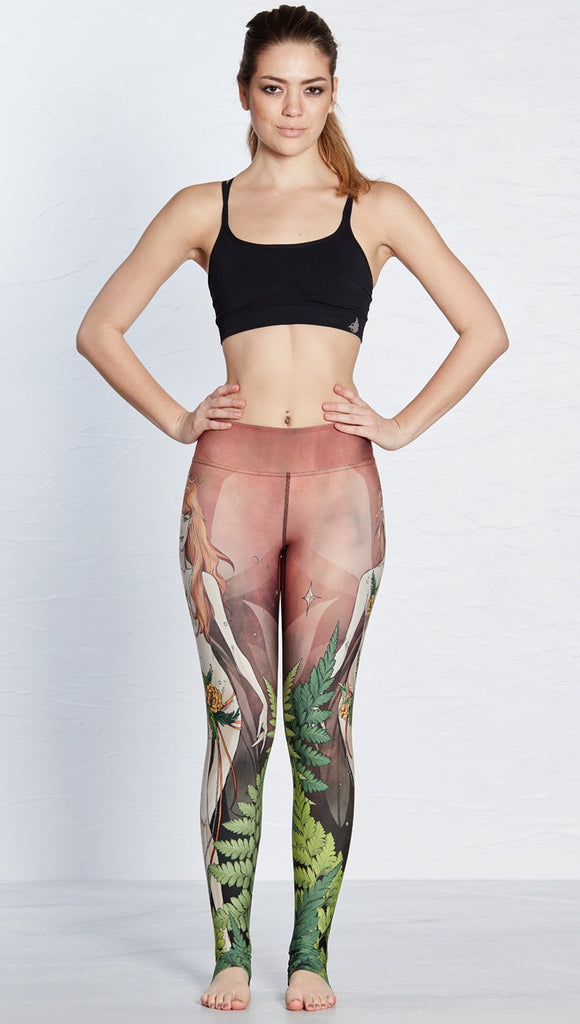 front view of model wearing pixie themed printed full length leggings