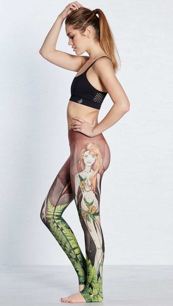 left side view of model wearing pixie themed printed full length leggings