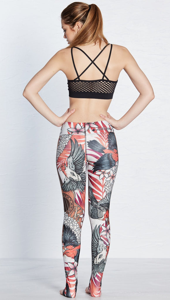 back view of model wearing vintage ukulele and bird themed printed full length leggings