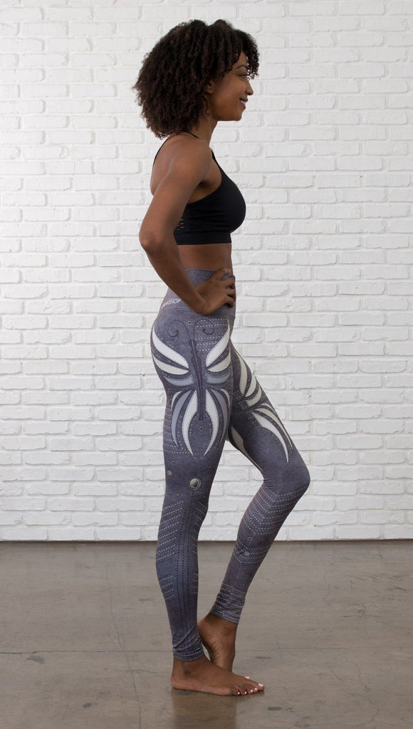 right side view of model wearing vintage flower printed full length leggings