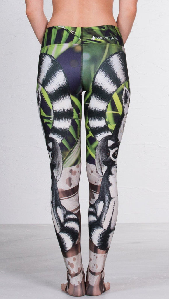 back view of model wearing lemur themed printed full length leggings