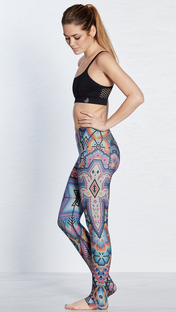 left side view of model wearing purple beaded lizard themed printed full length leggings