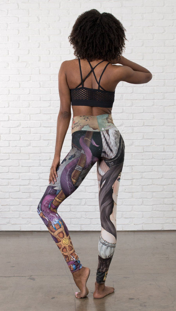 back view of model wearing pirate girl mashup themed printed capri leggings