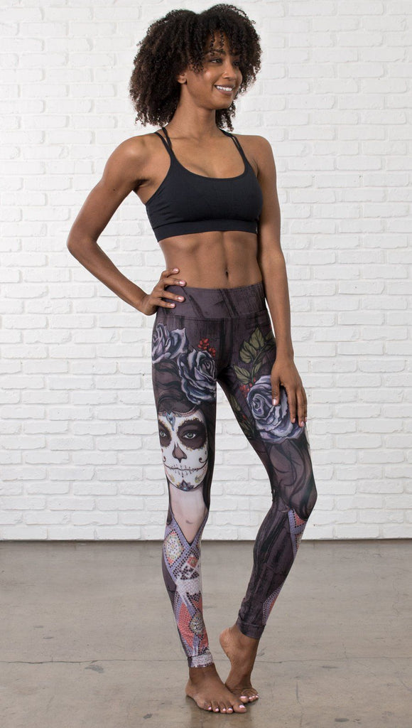 front view of model wearing sugar skull themed printed full length leggings