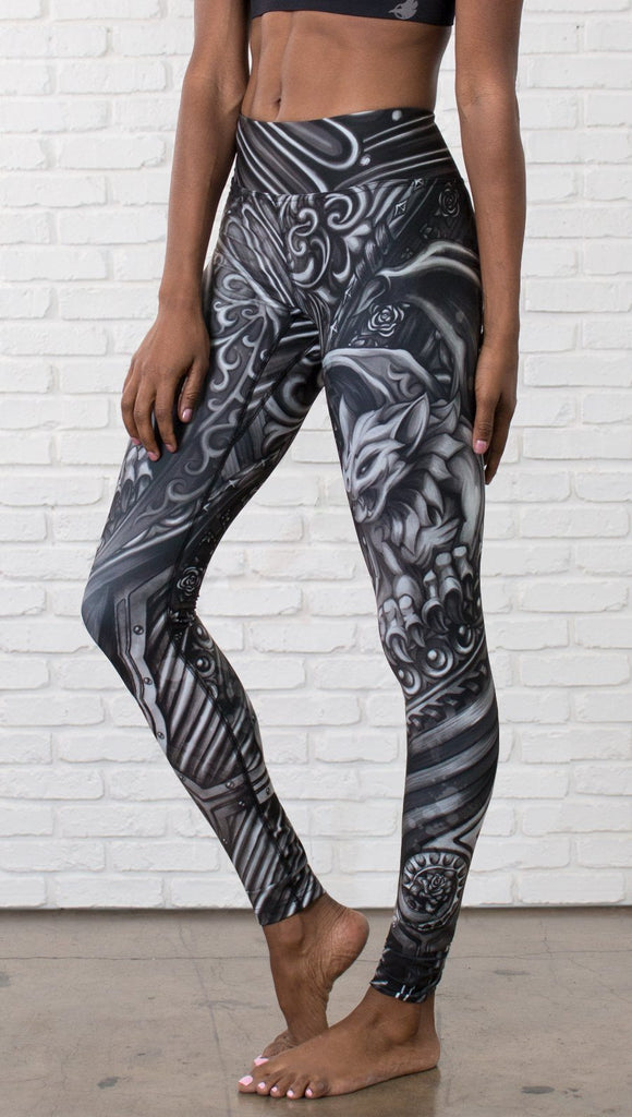 closeup front view of model wearing galaxy themed printed full length leggings