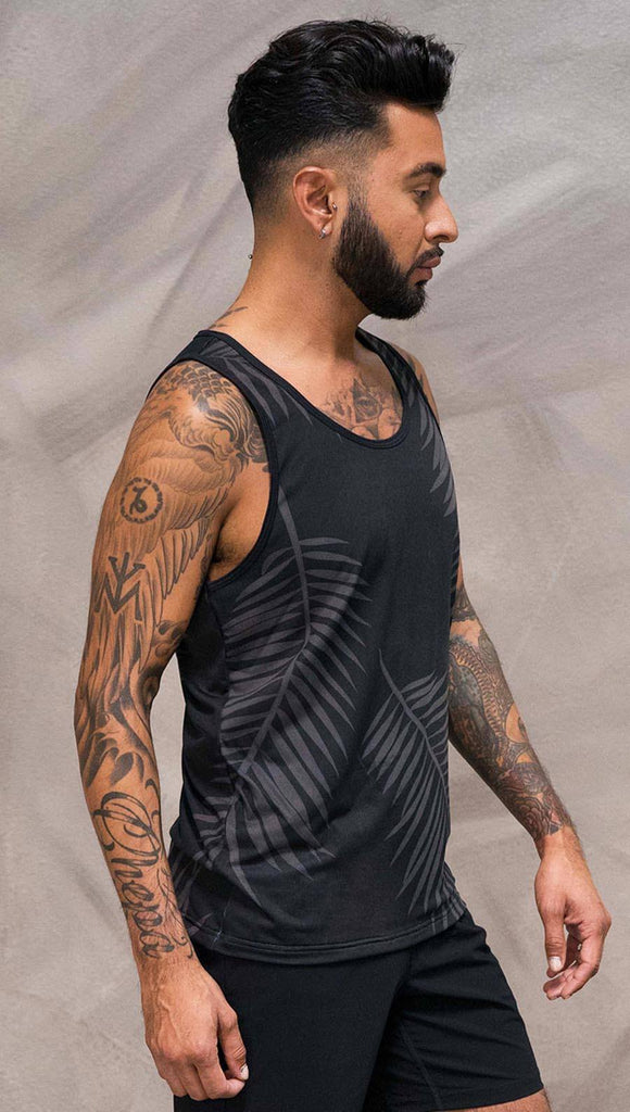 Close up right side view of model wearing black tank top with white palm art