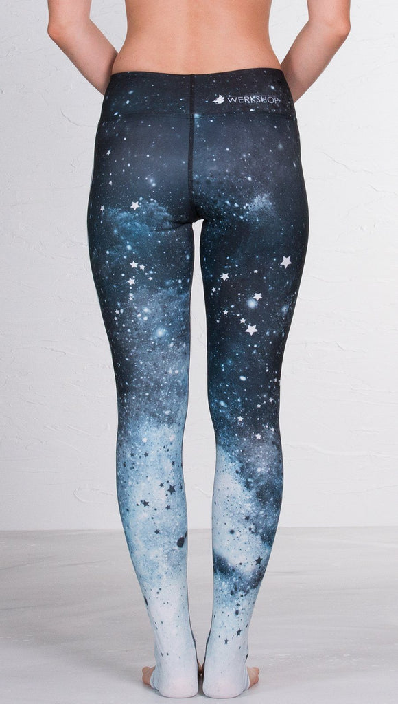 closeup back view of model wearing moon cycle design printed full length leggings