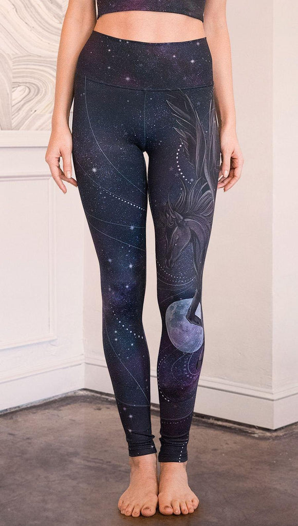 closeup front view of model wearing fantasy flying pegasus themed printed full length leggings