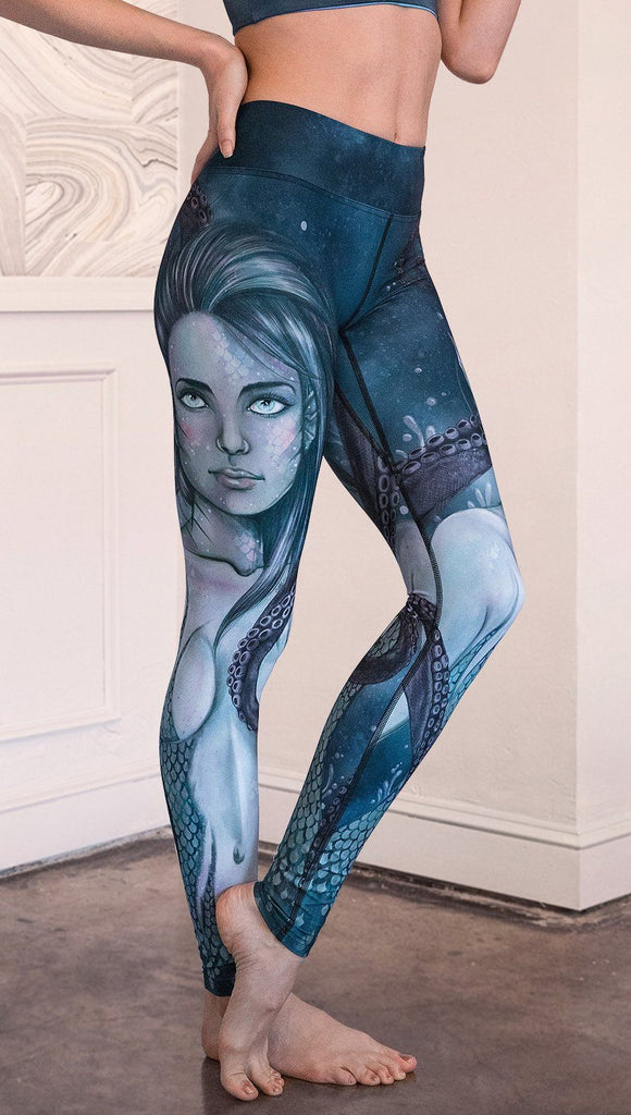 closeup right side view of model wearing full length leggings with mermaid and tentacles printed design