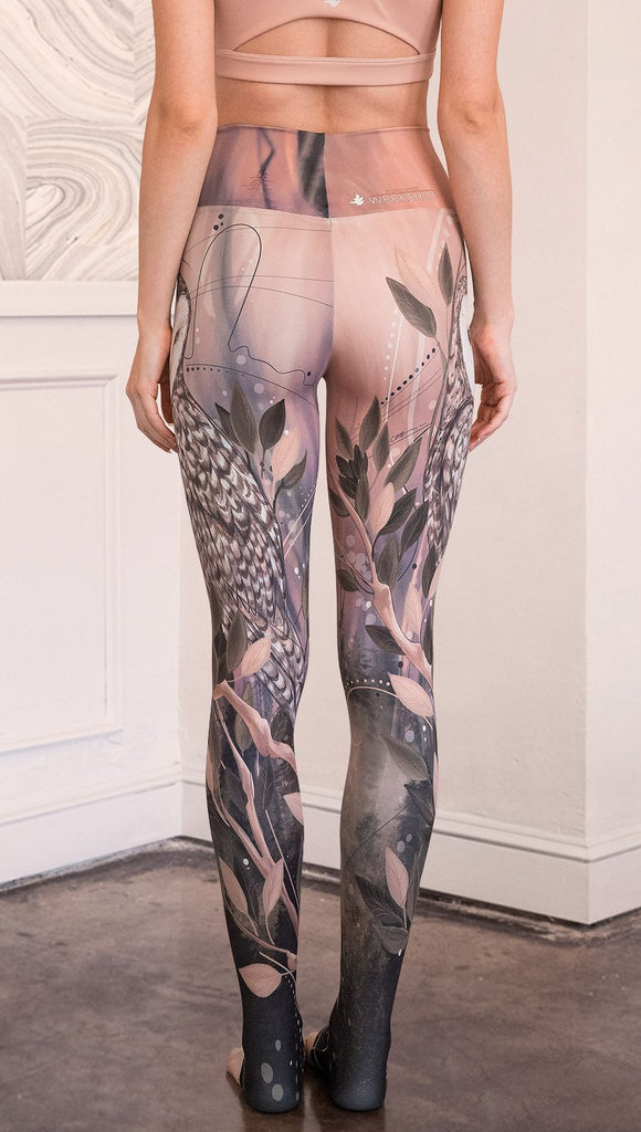 closeup back view of model wearing owl themed full length leggings