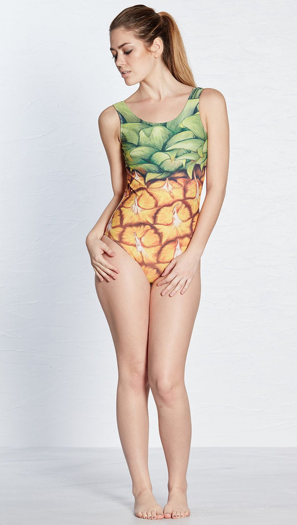 front view of model wearing pineapple themed one piece swimsuit / leotard 