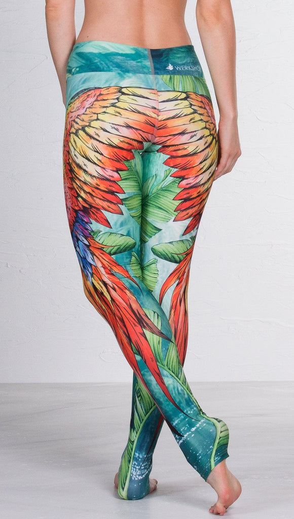 closeup back view of model wearing macaw themed full length leggings