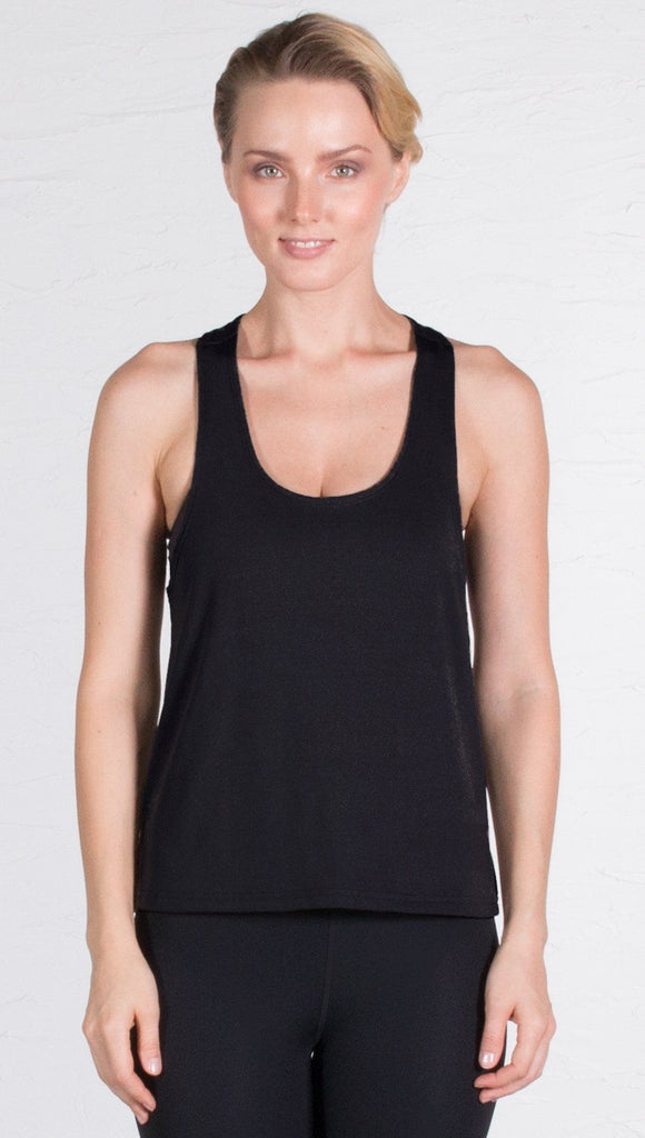 closeup front view of model wearing black sports tank top