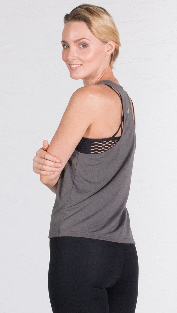 closeup back view of model wearing gray sports tank top