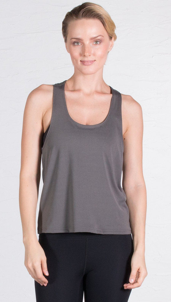 closeup front view of model wearing gray sports tank top