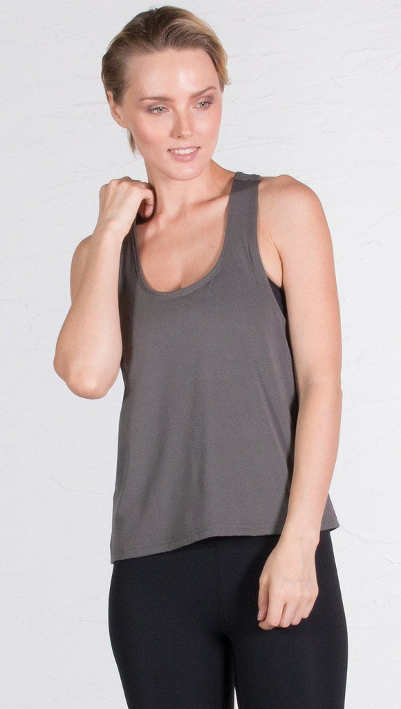 closeup front view of model wearing gray sports tank top