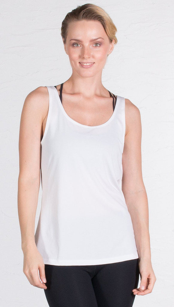 closeup front view of model wearing white sports tank top