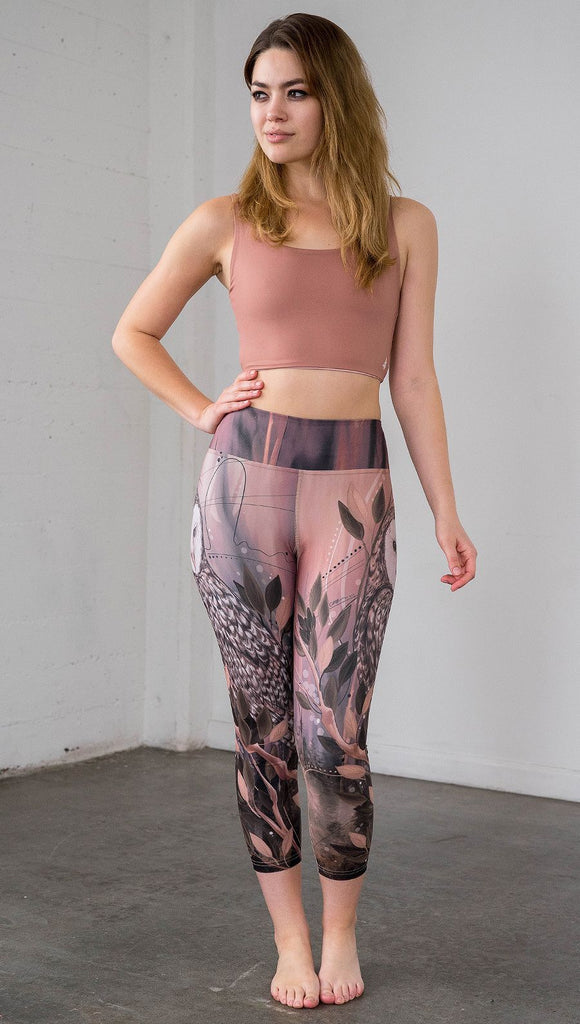 front view of model wearing owl themed capri leggings