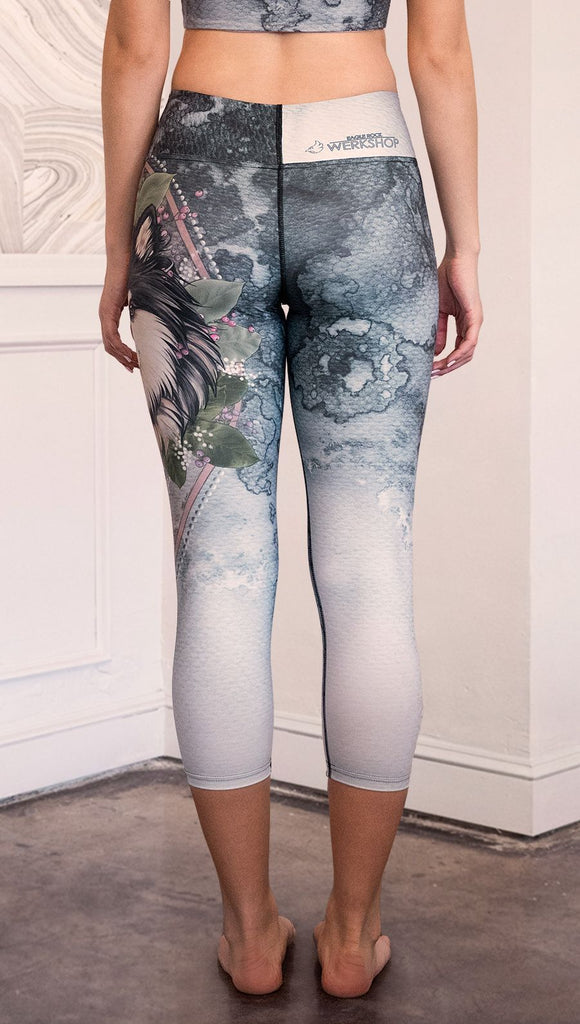 closeup back view of model wearing capri Finnish Lapphund artwork themed leggings