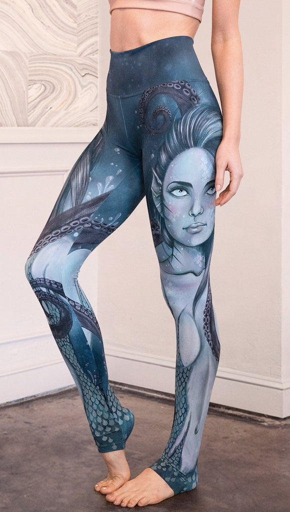 closeup left side view of model wearing full length leggings with mermaid and tentacles printed design