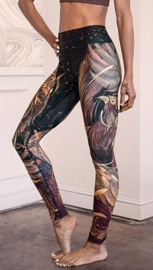 closeup left side view of model wearing phoenix themed full length leggings