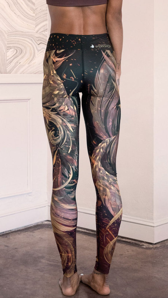 closeup front view of model wearing phoenix themed full length leggings