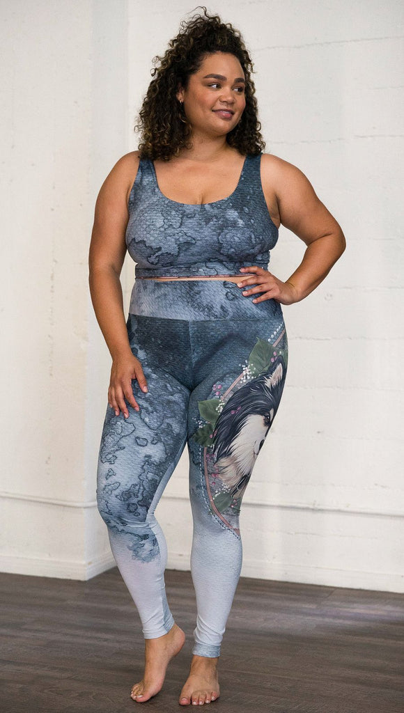 Front view of model wearing full length Finnish Lapphund artwork themed leggings