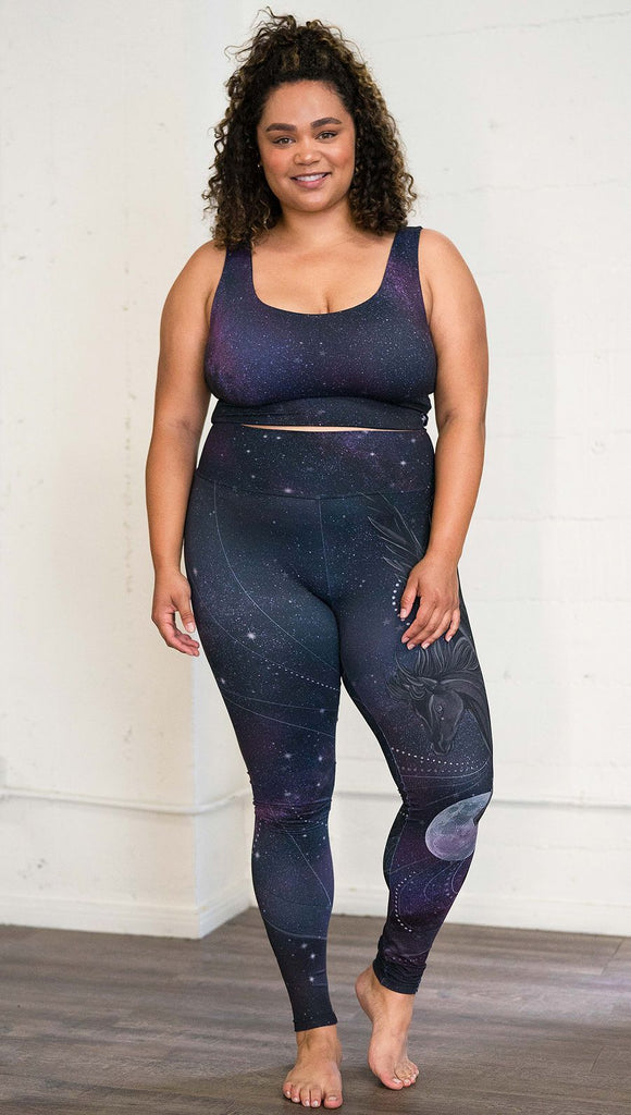 front view of model wearing fantasy flying pegasus themed printed full length leggings