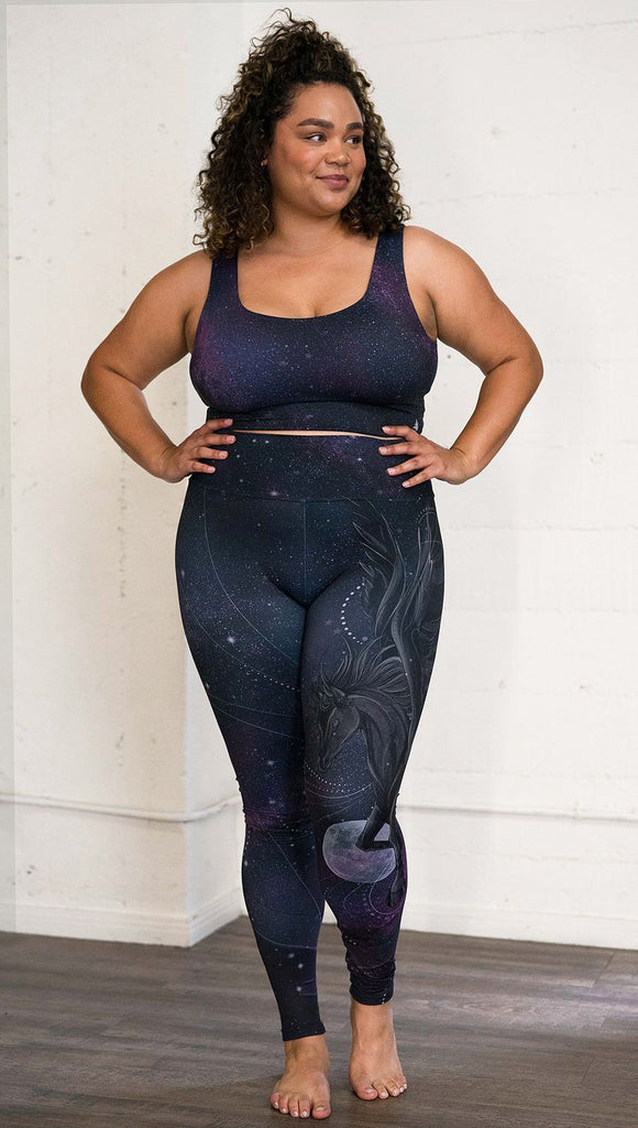 front view of model wearing fantasy flying pegasus themed printed full length leggings