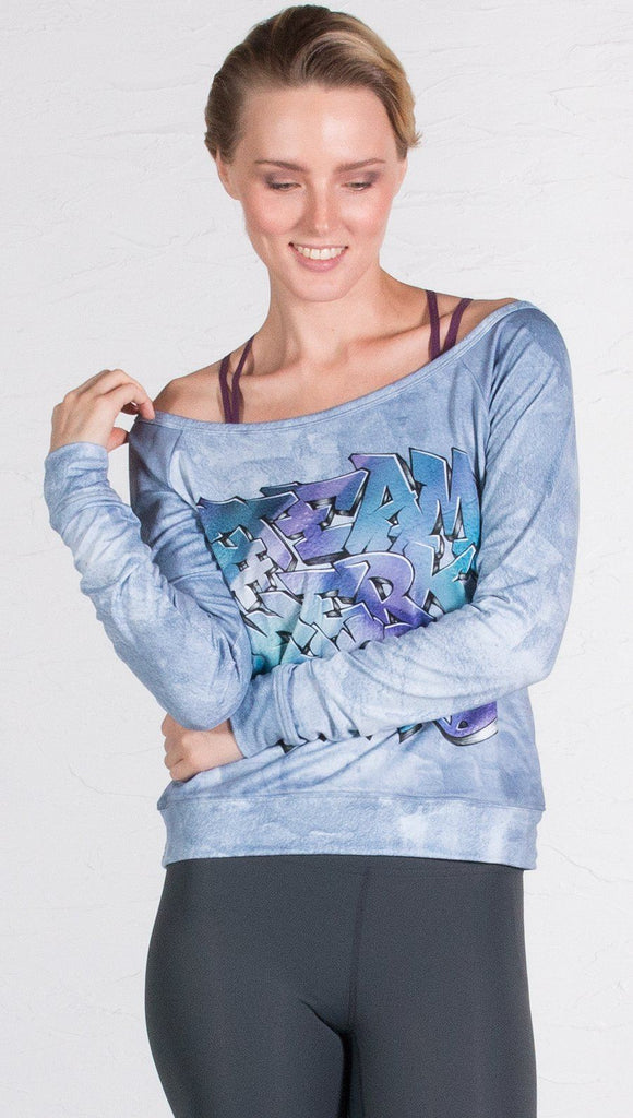 front view of model wearing graffiti design pullover 