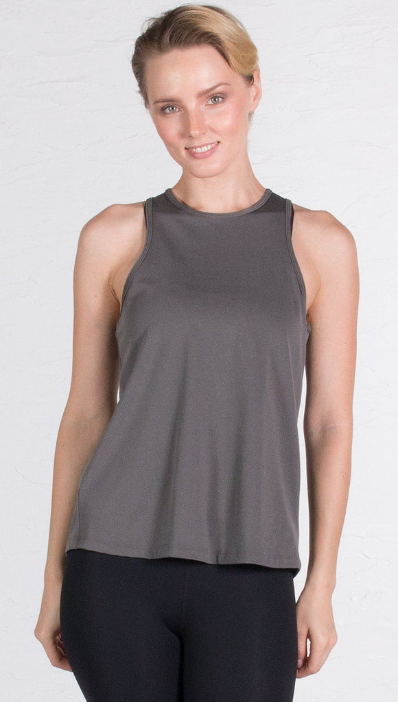 closeup front view of model wearing gray tie back sports tank top