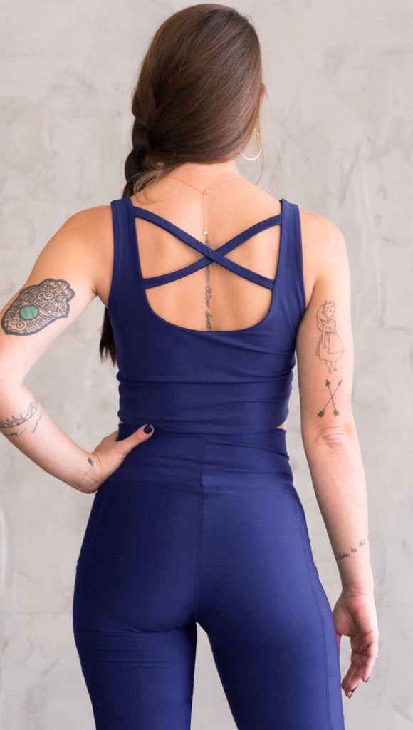 model wearing WERKSHOP four way with the X in the back and royal blue showing