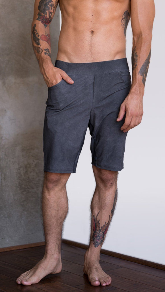 close up front view of model wearing gray mens performance shorts