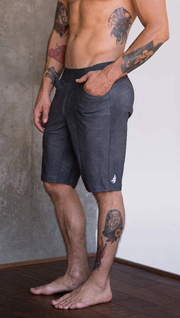 close up left side view of model wearing gray mens performance shorts