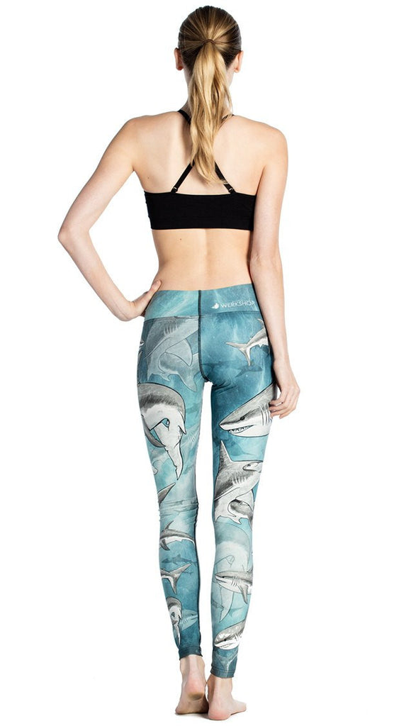 back view of model wearing shark themed printed full length leggings