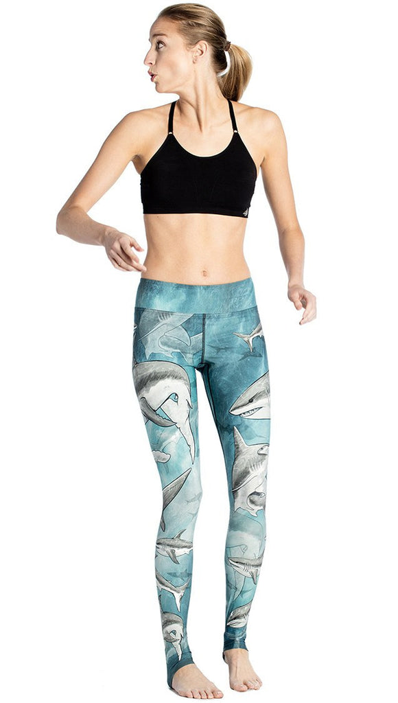 front view of model wearing shark themed printed full length leggings